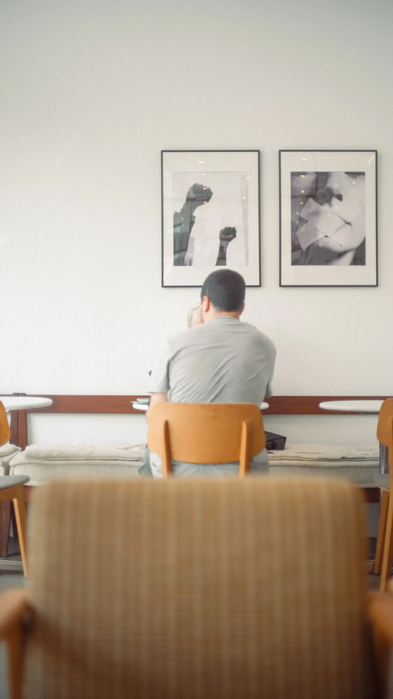 People in a cafe setting, illustrating the Capyfriends capybara cafe experience in Helen, Georgia