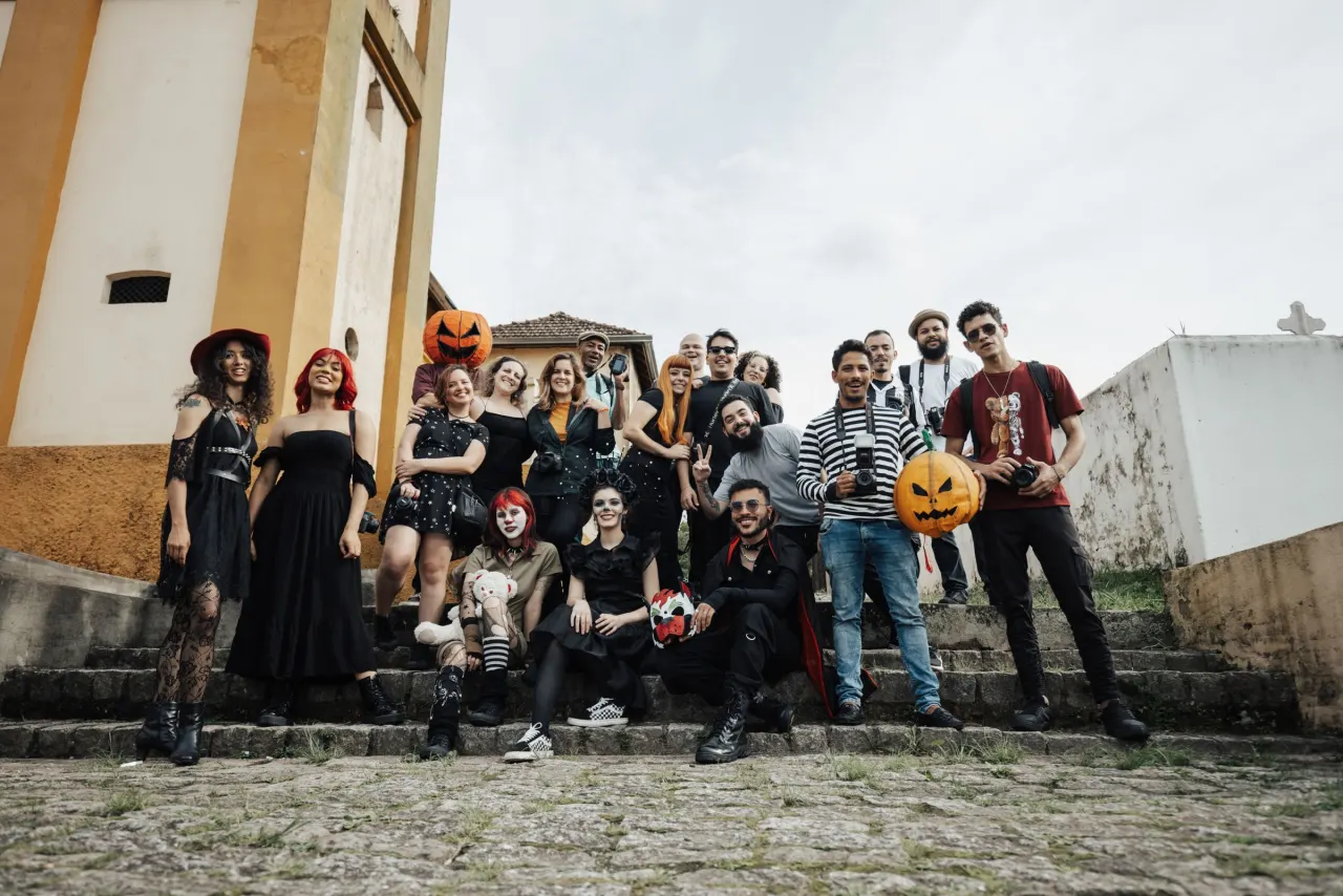 People at a Halloween party with pumpkins for a capybara Halloween party guide