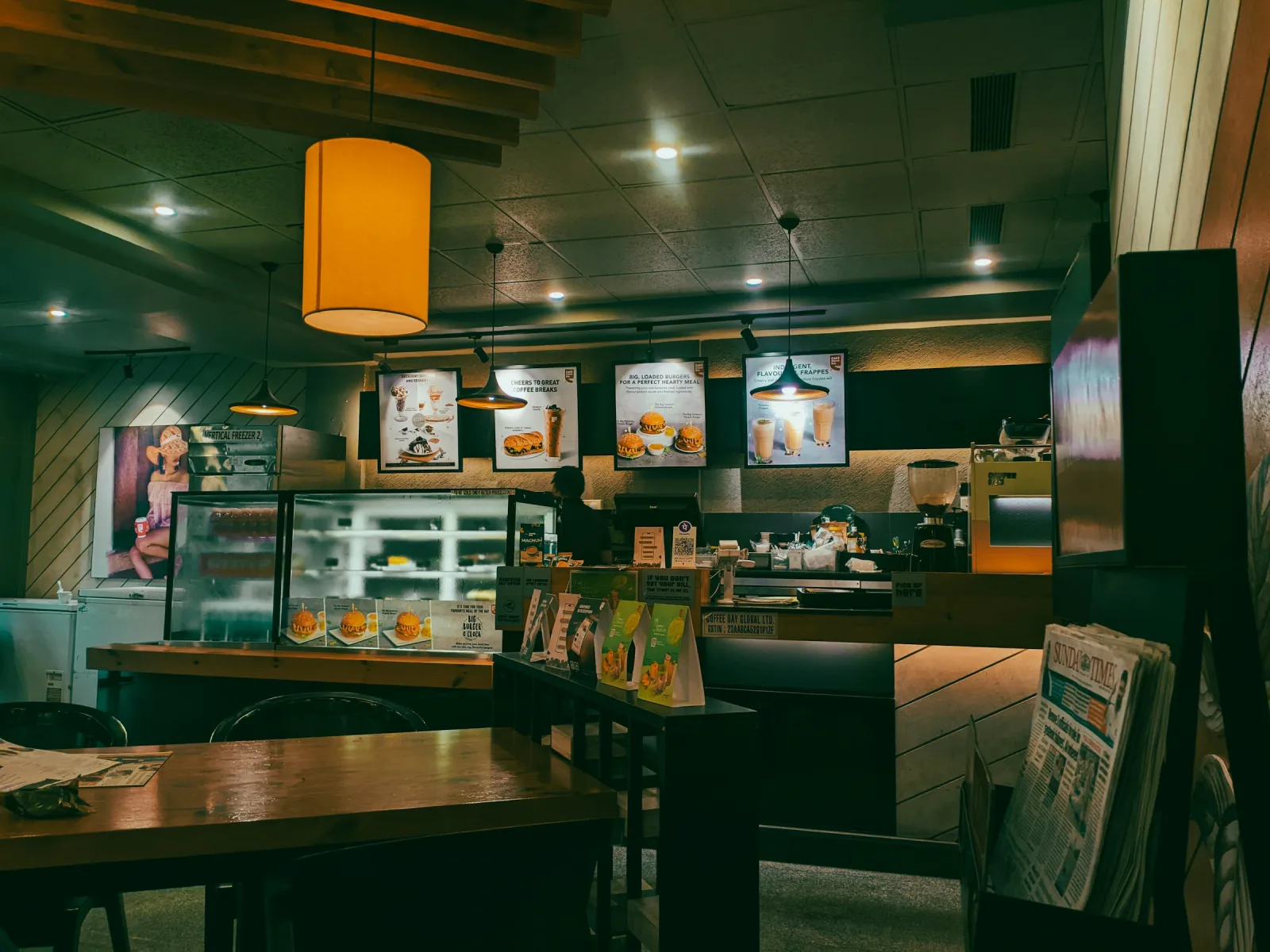 A cozy cafe interior with warm light and capybara-coded calm